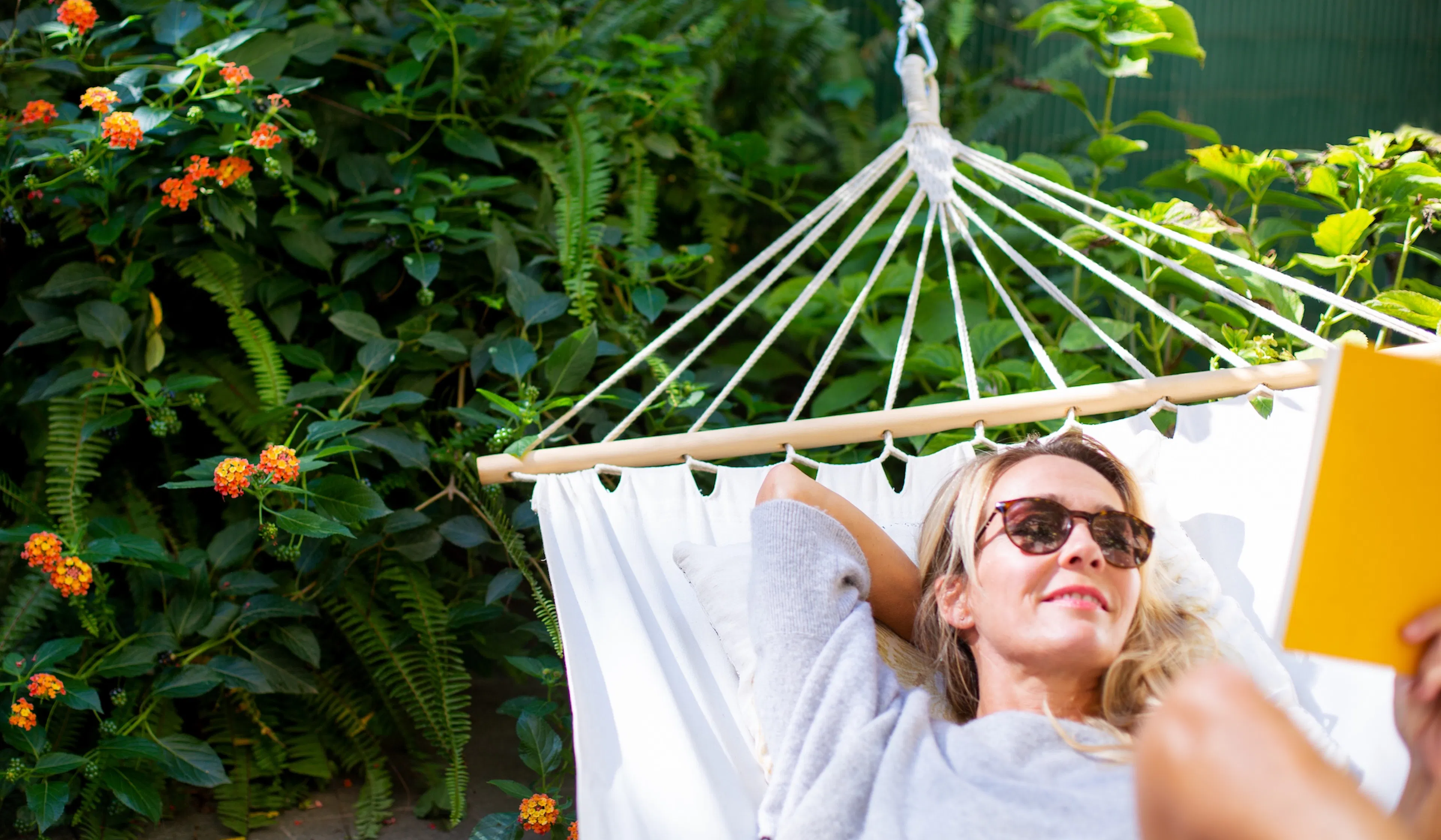 Woman relaxing in hammock