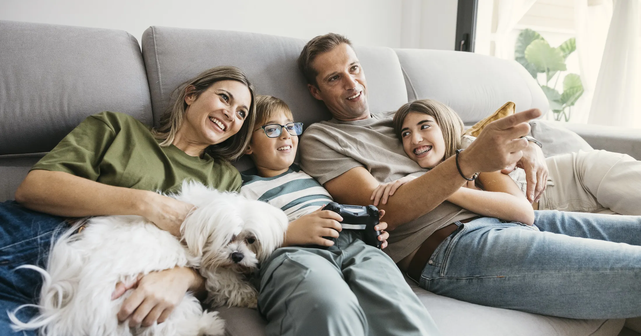 Family relaxing on couch