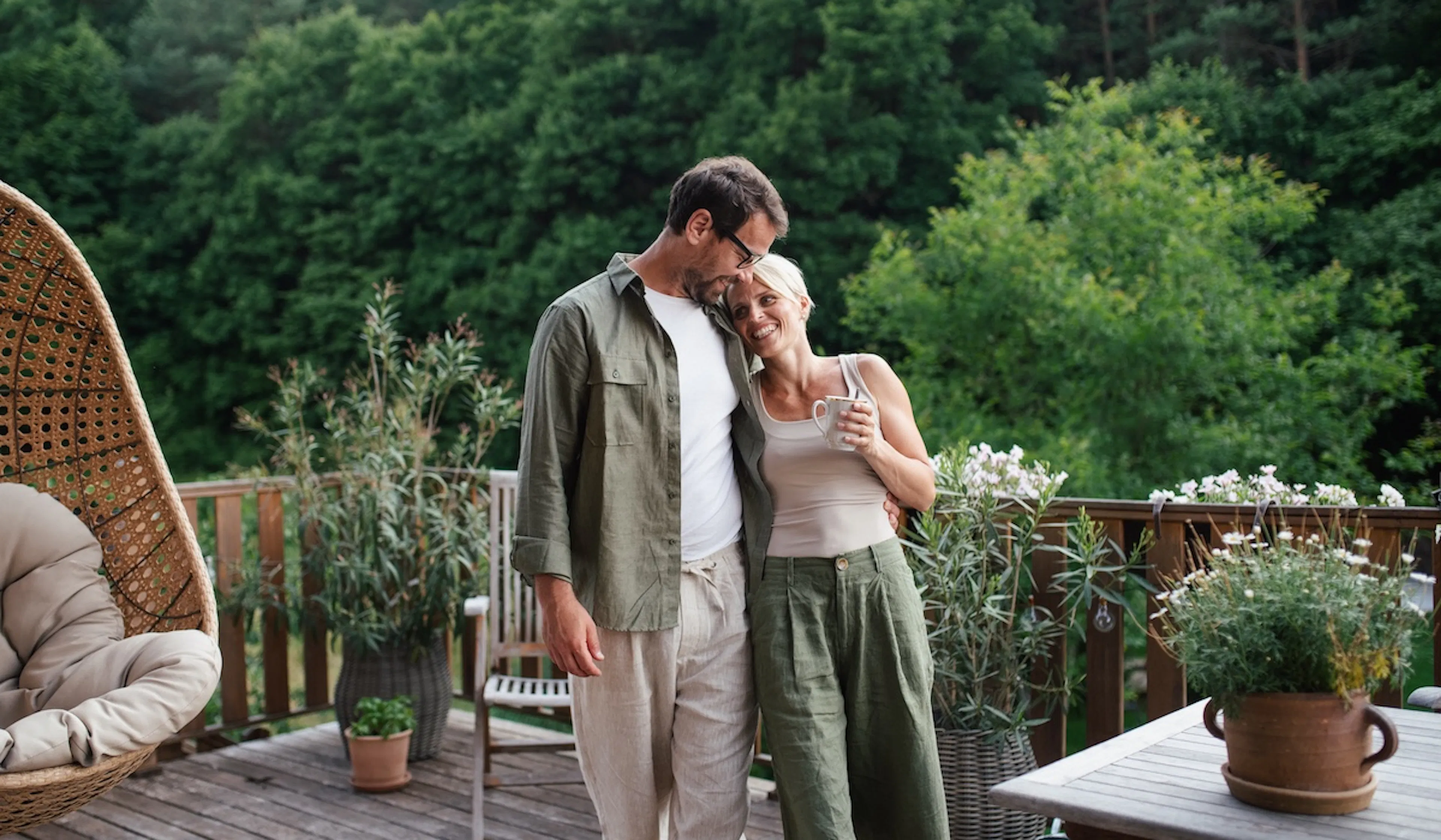 happy couple outside drinking tea
