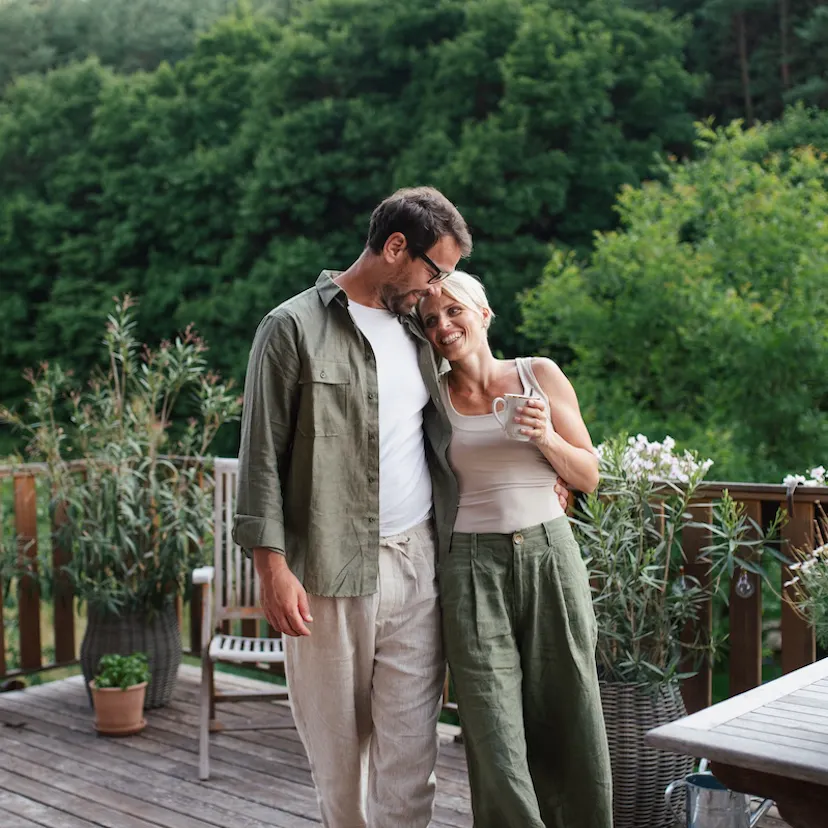 happy couple outside drinking tea