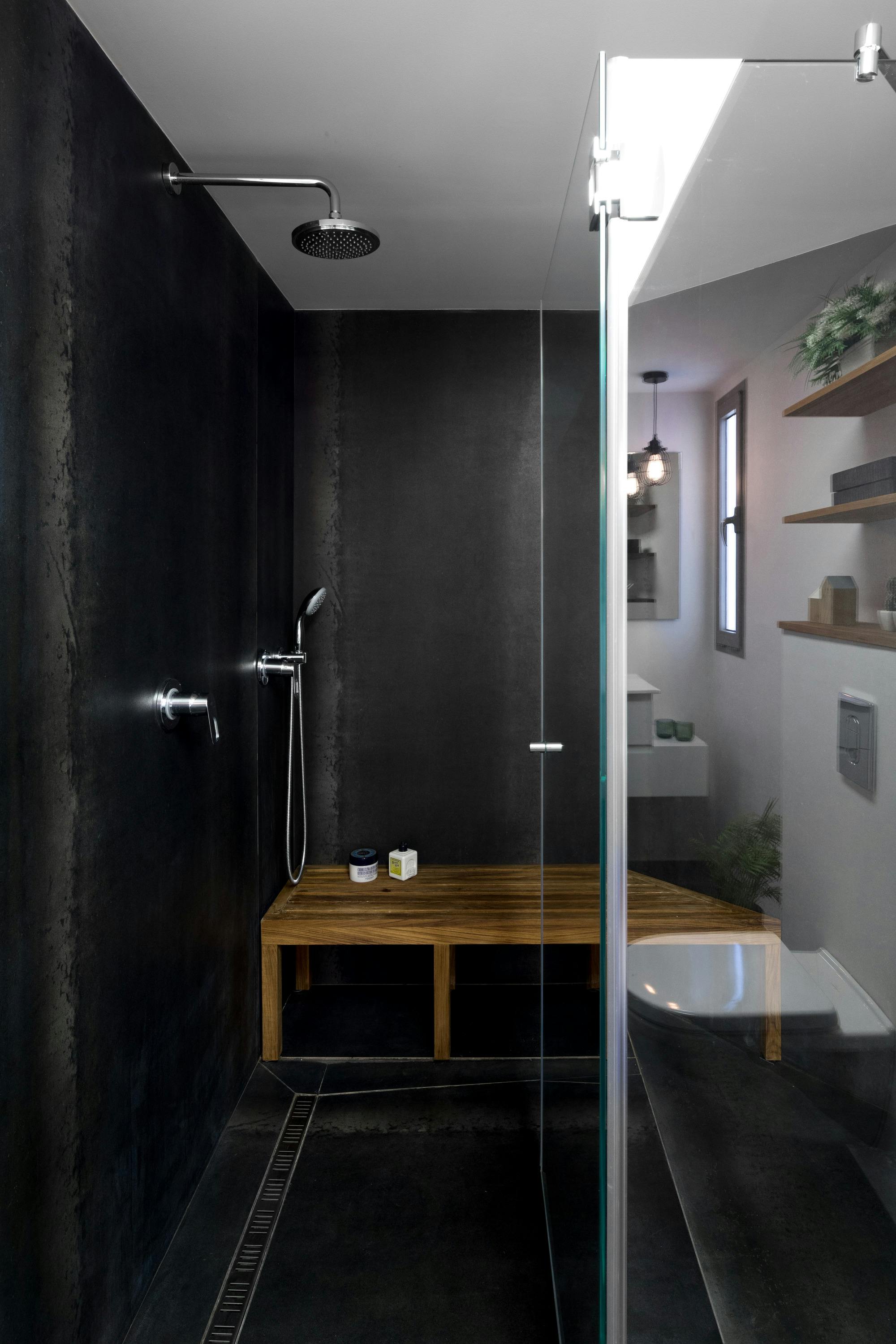 bathroom renovation with black tiling