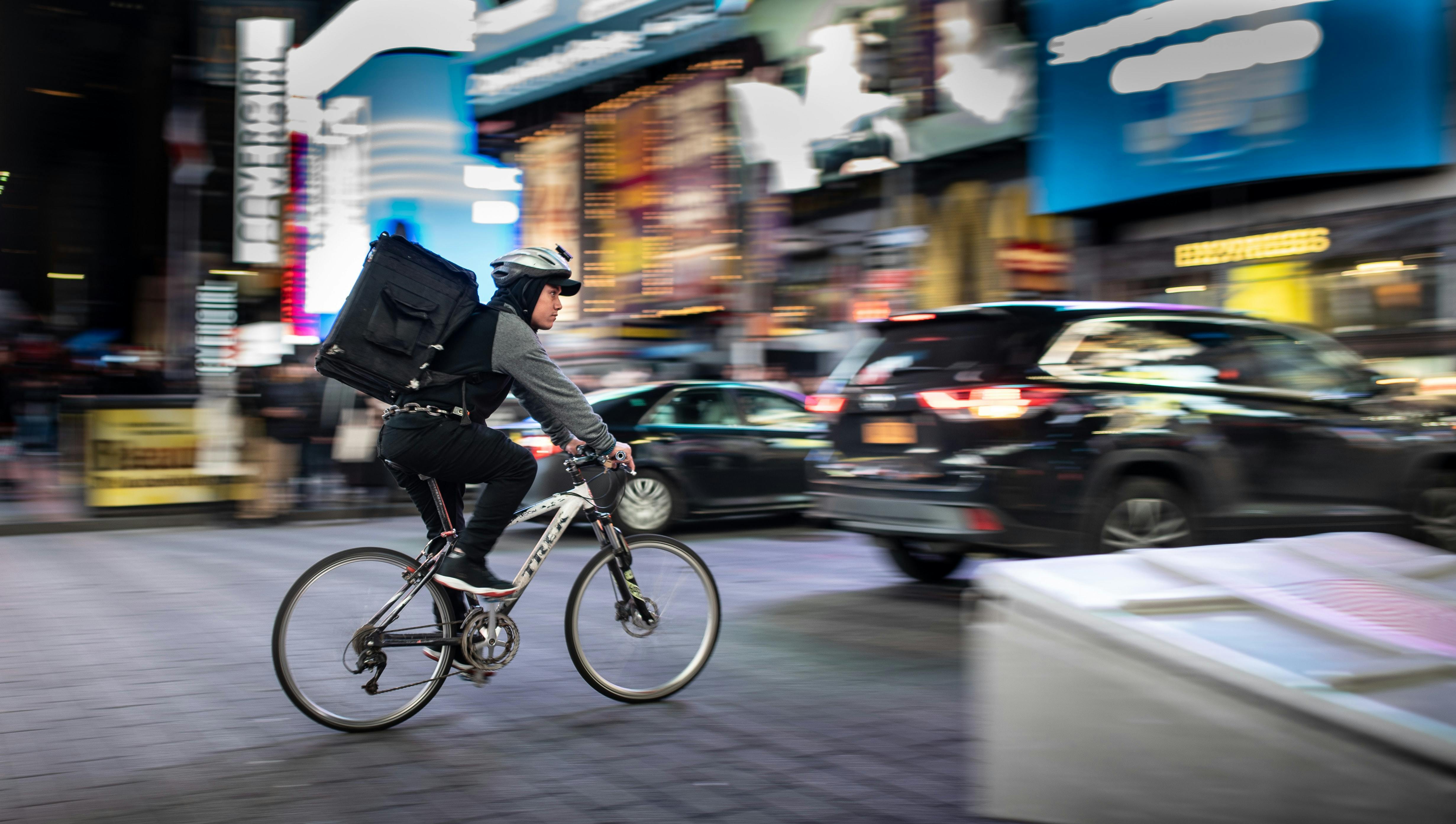 Delivery person on bicycle