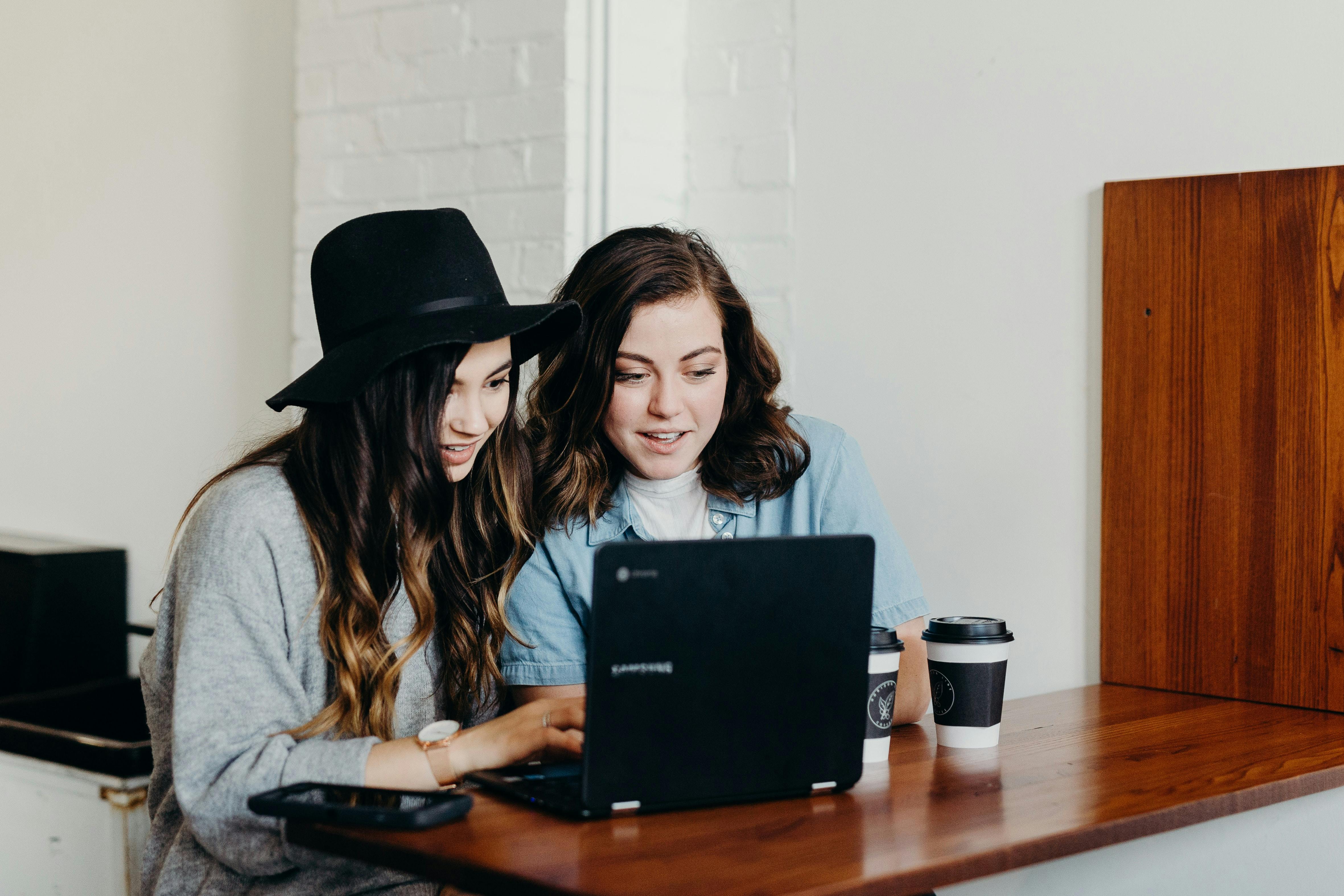 Friends using laptop