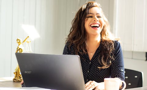 Woman Typing on Computer