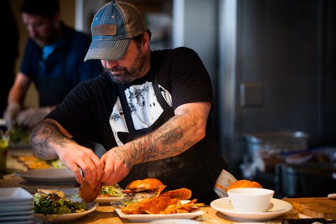 Owner Cooking In His Restaurant