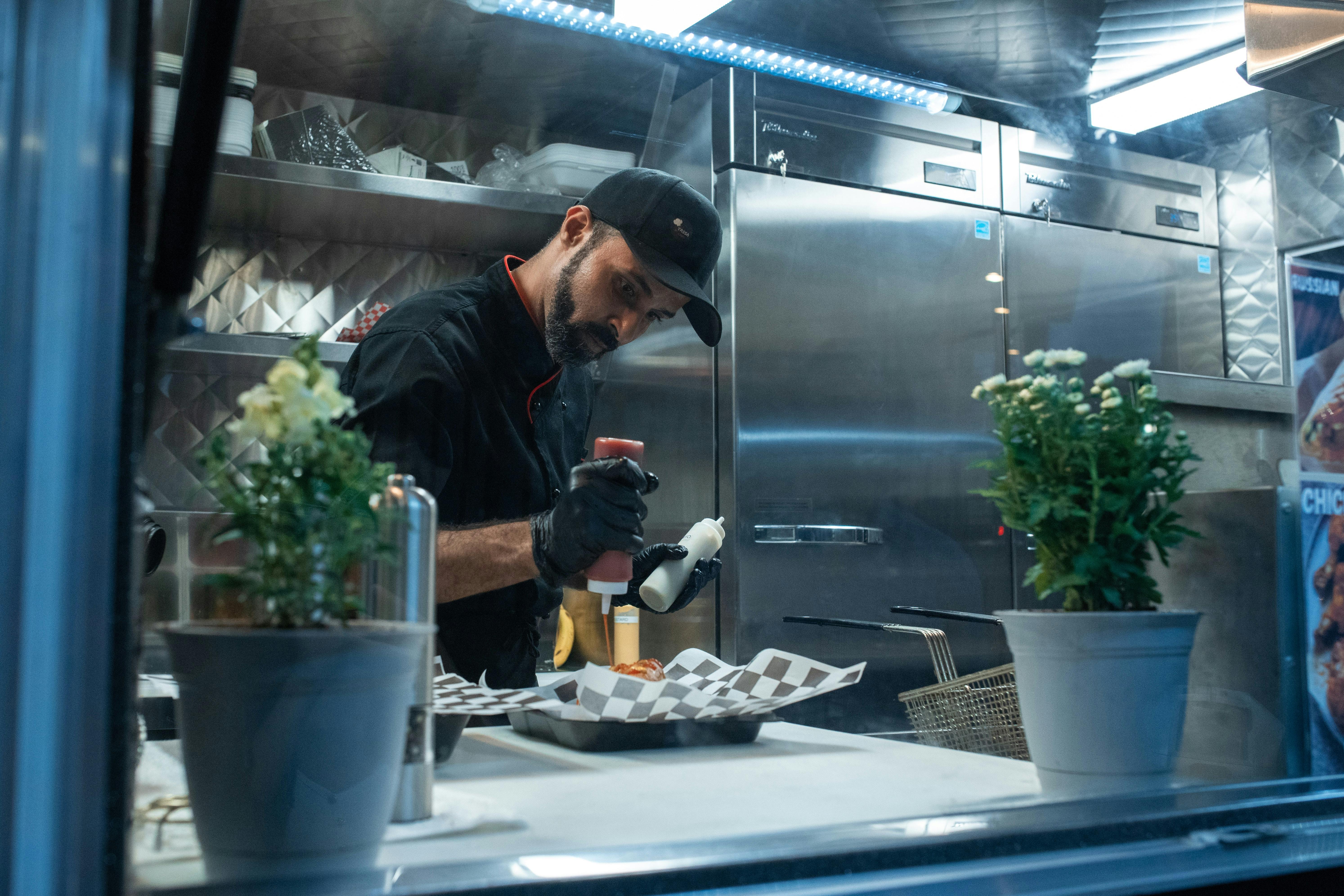 Food truck owner preparing plate