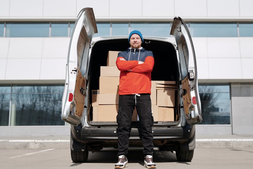 Man standing in front of delivery van