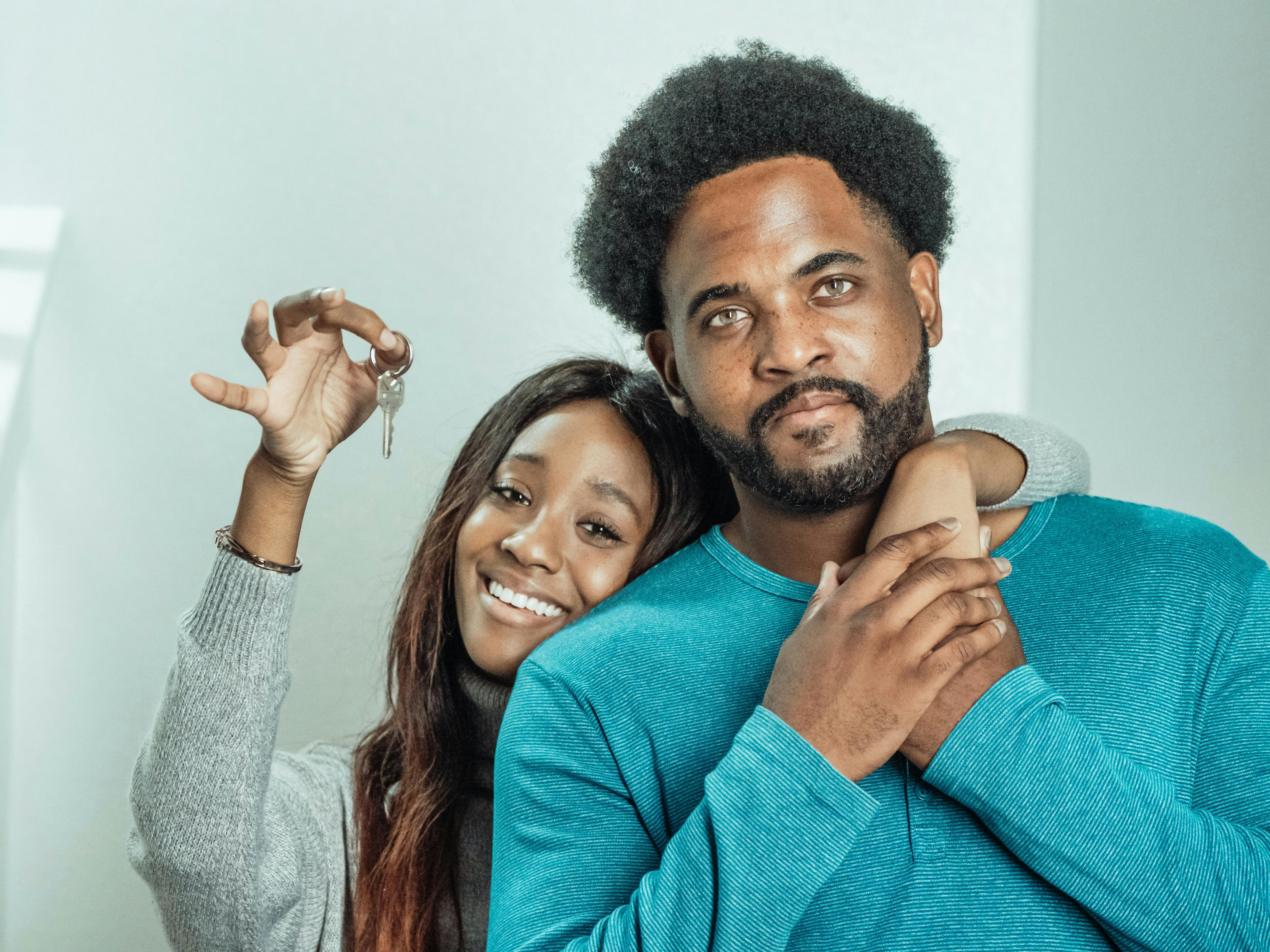 Couple holding new house keys