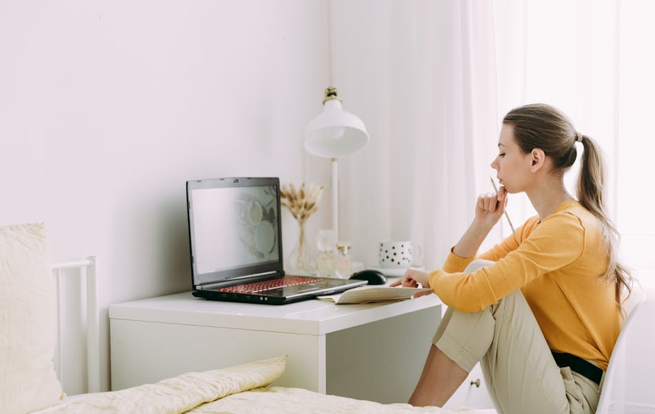 Woman at home on laptop