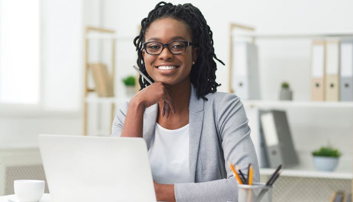 business woman with laptop smiling