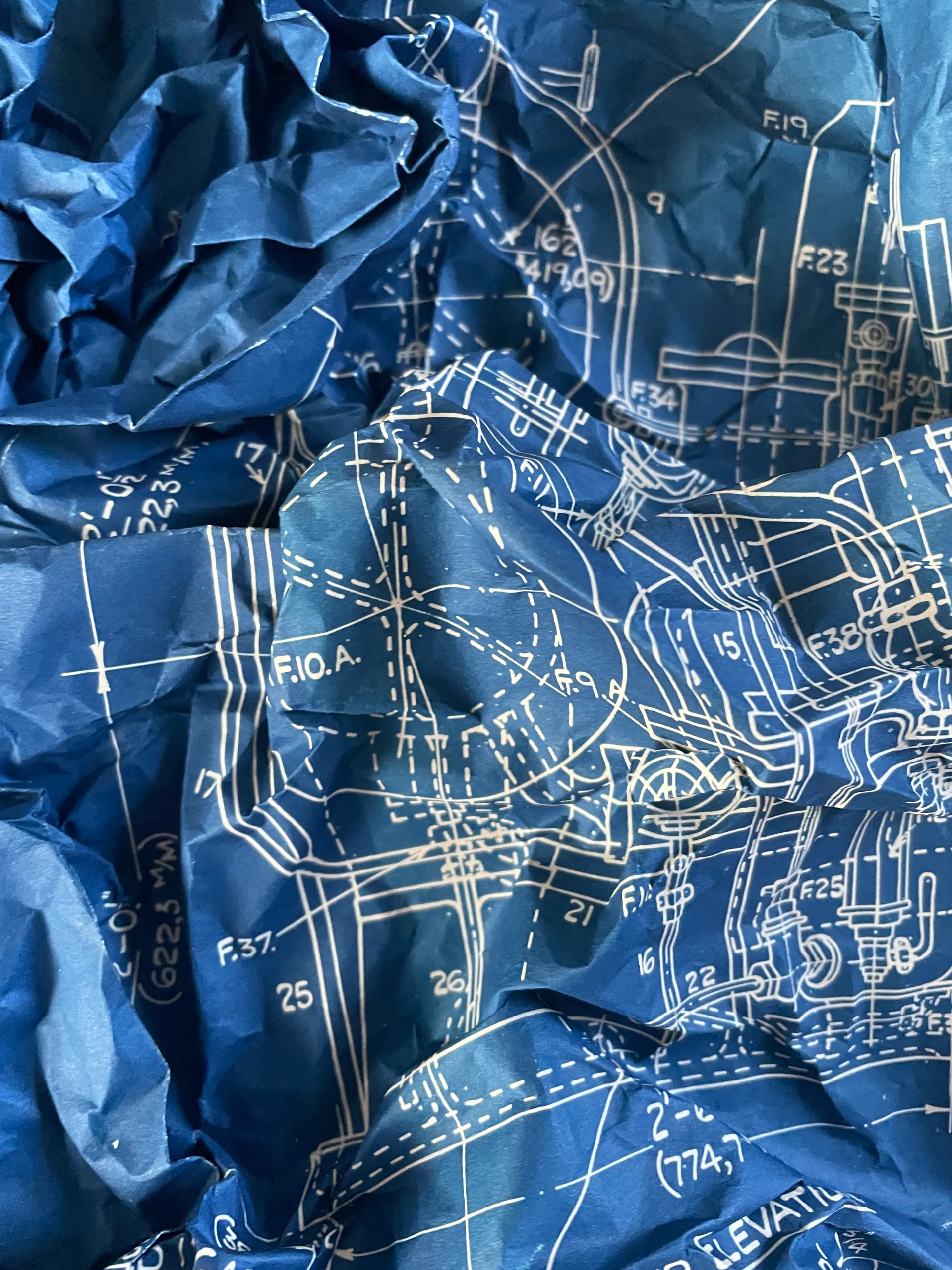 Detailed blueprint elevations, white lines on blue