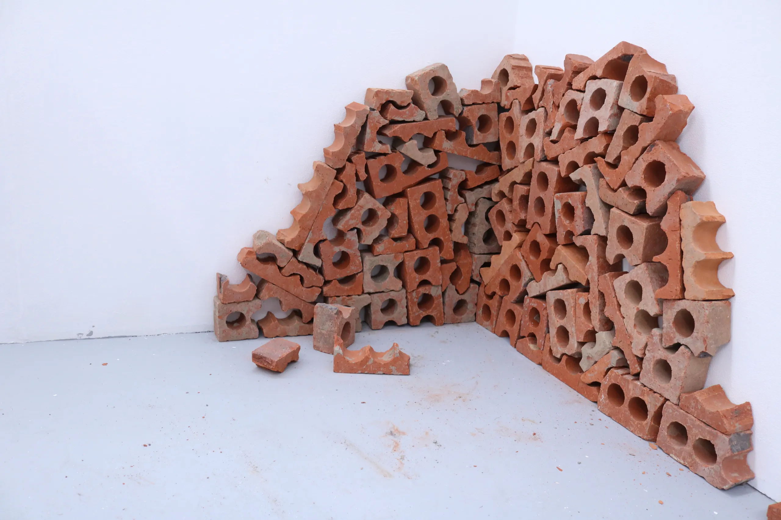 An arch of broken brick built across a corner