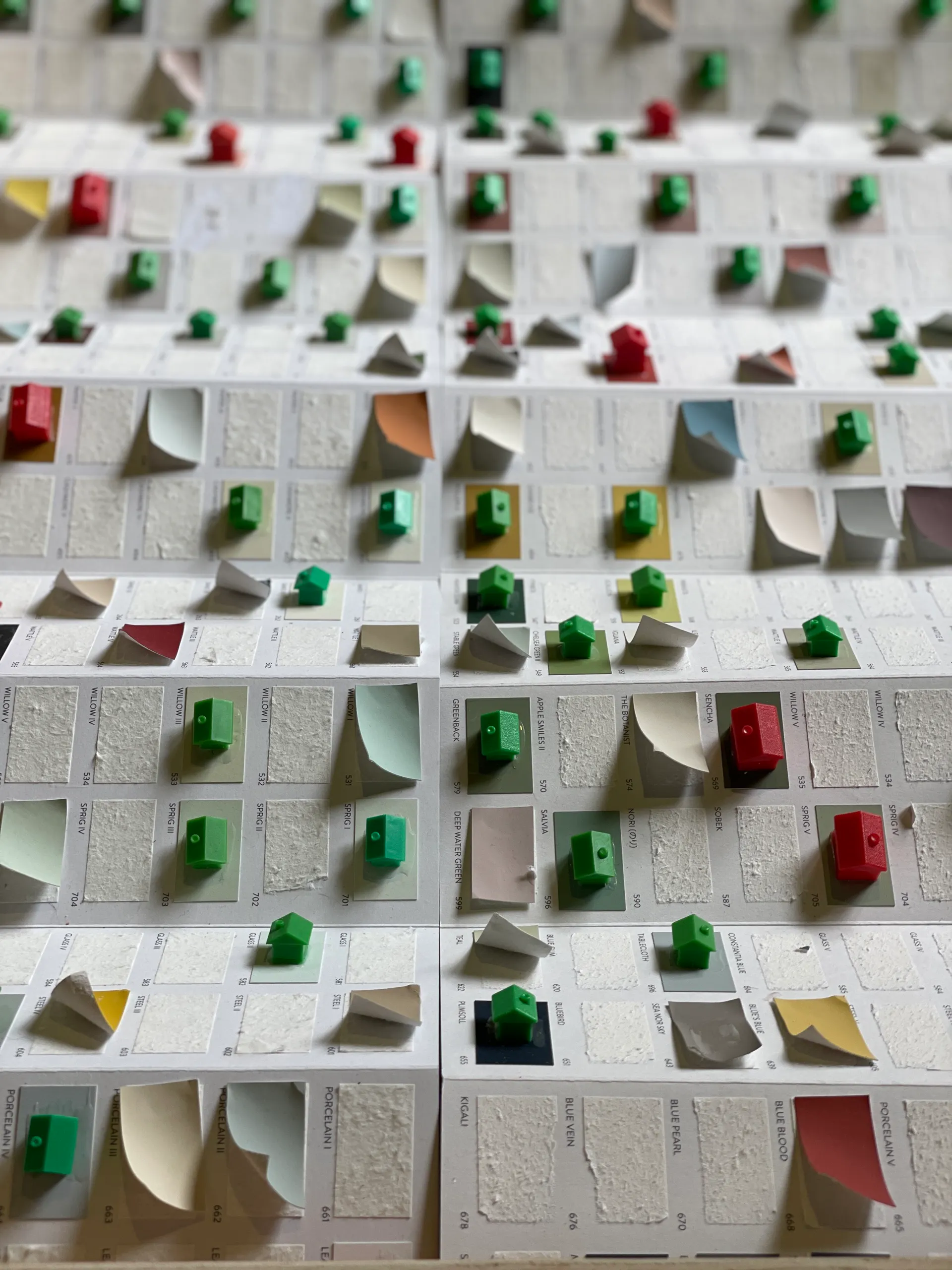 Paint charts set with green houses and red hotels
