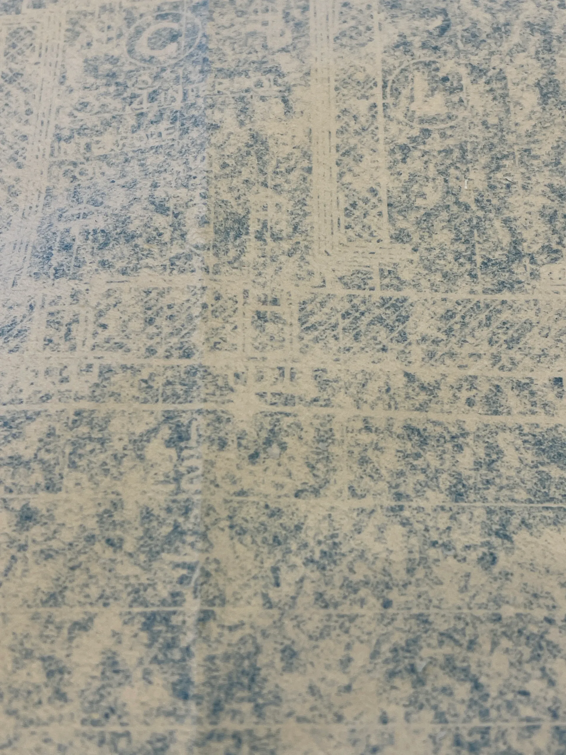 A faint plaster impression of a blueprint