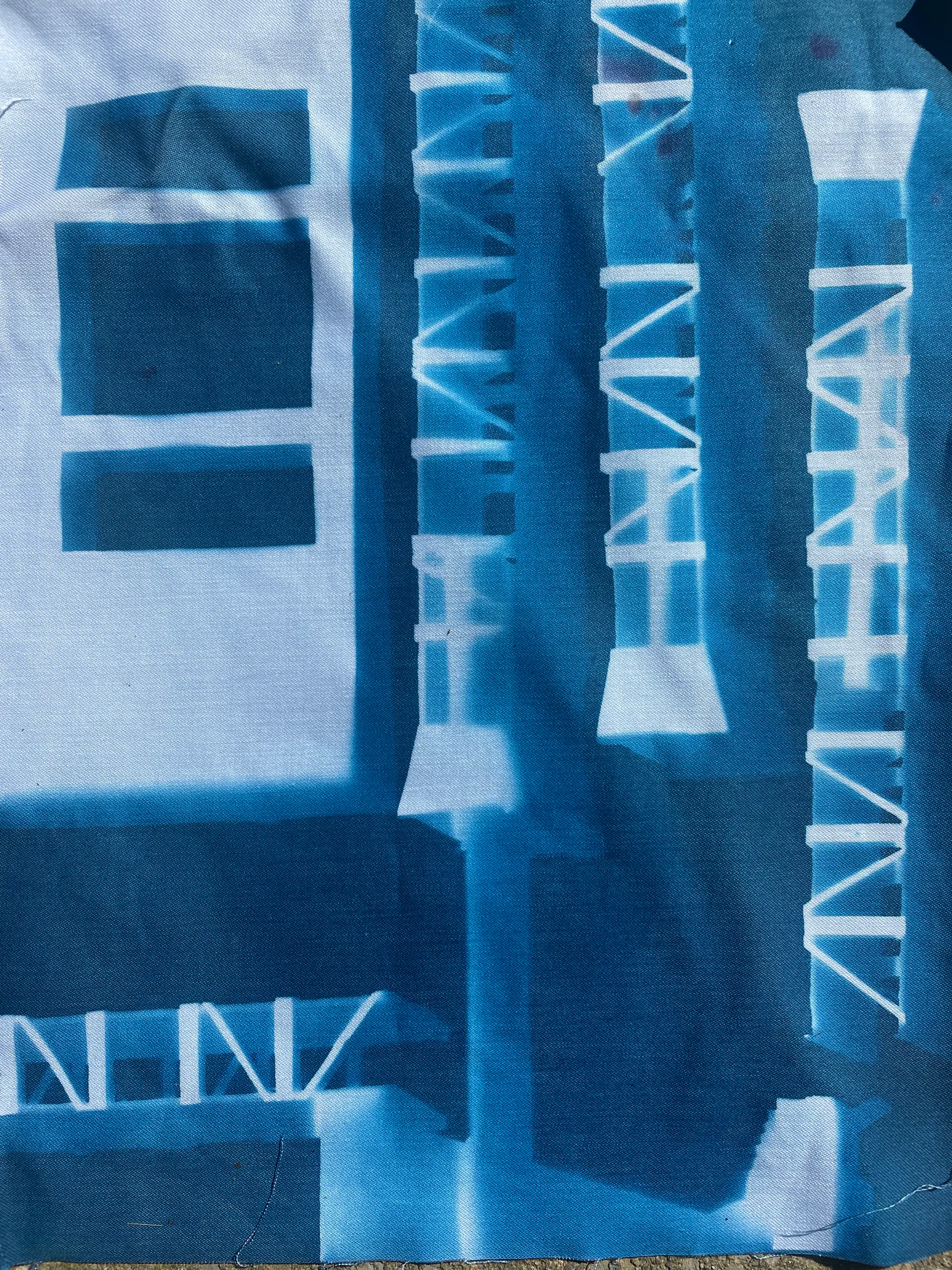 A cyanotype on linen: gantry towers and building forms in Prussian blue