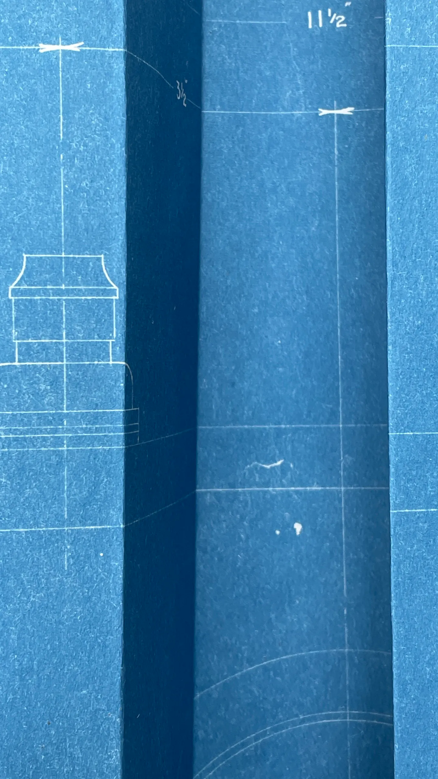 Folded blueprint paper in close-up