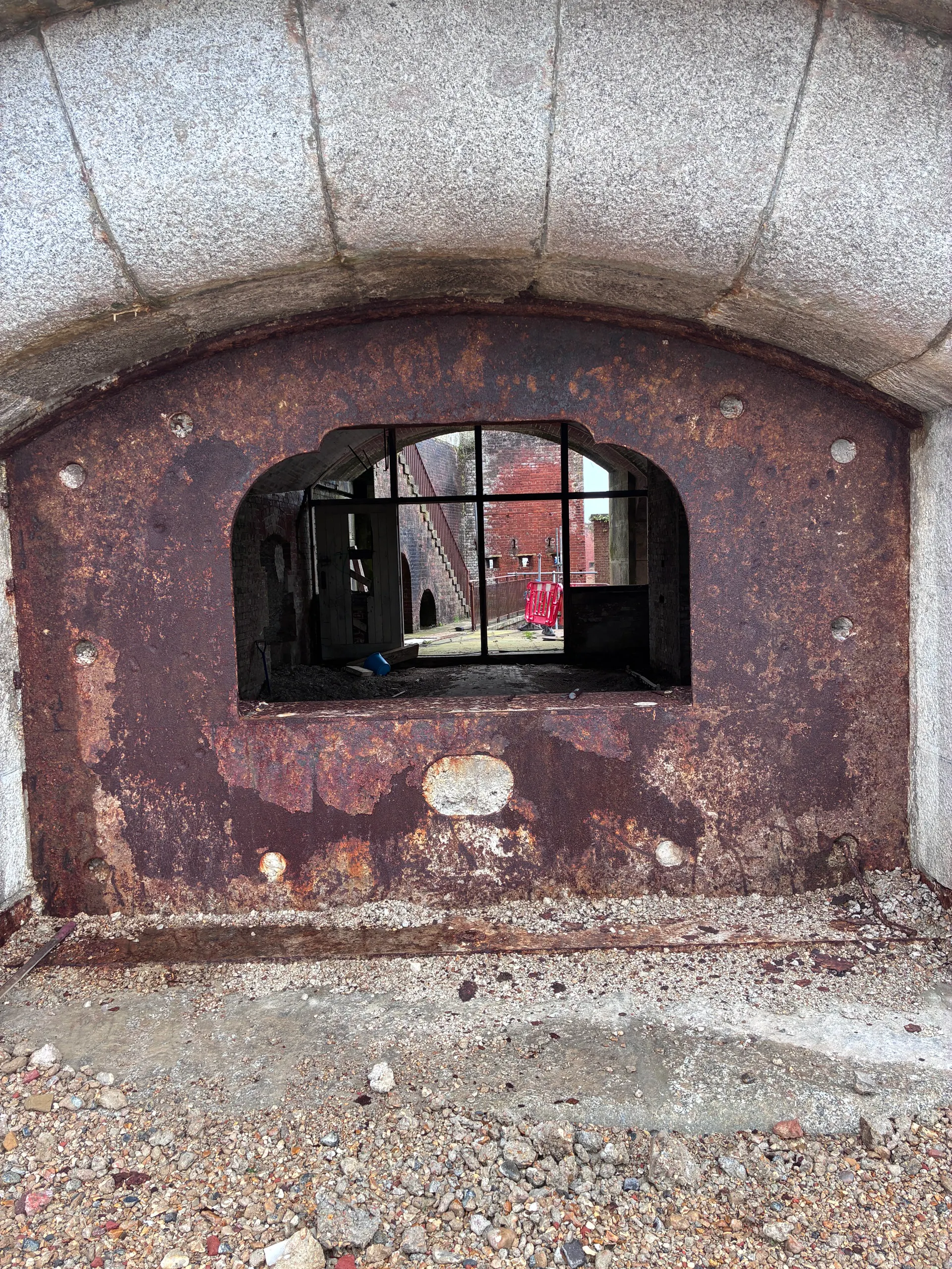 An ironwork shield frame around a casemate opening