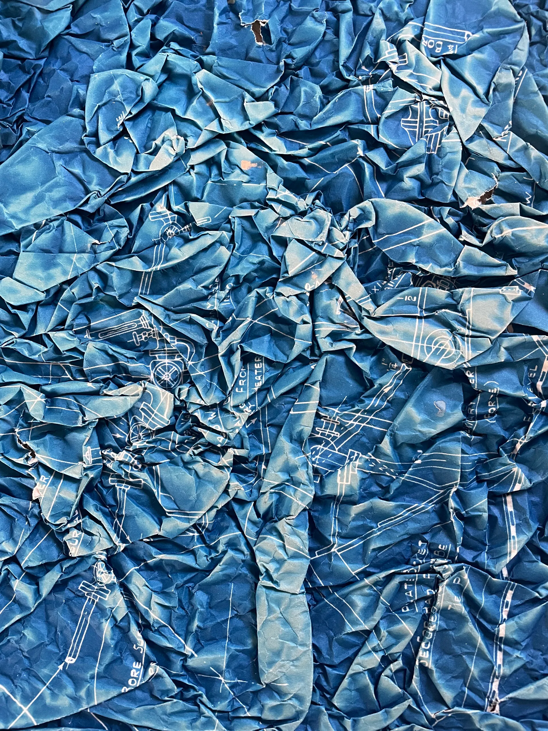 Crumpled blueprint paper