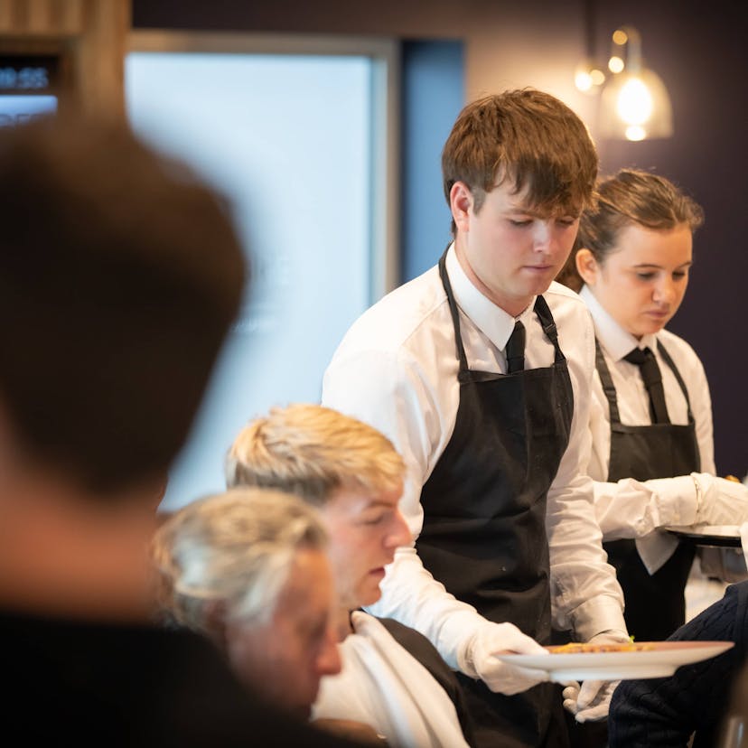 waiter handing out food