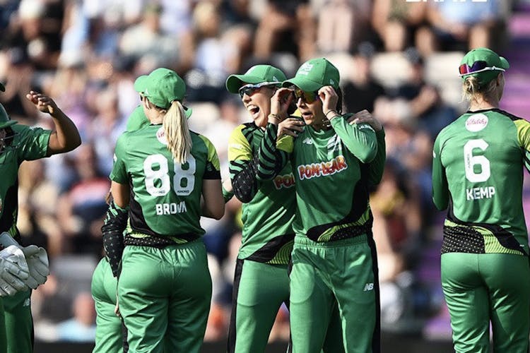 women's cricket team celebrating