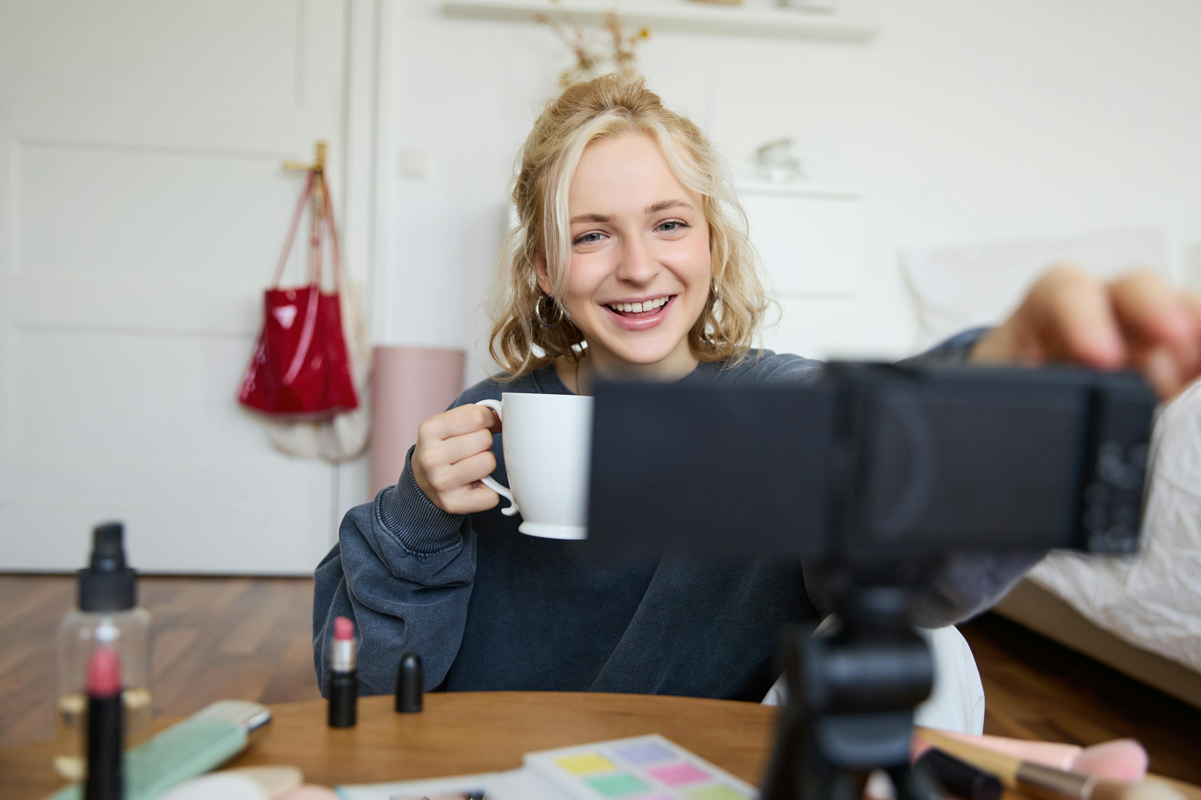 woman filming a video on her phone 