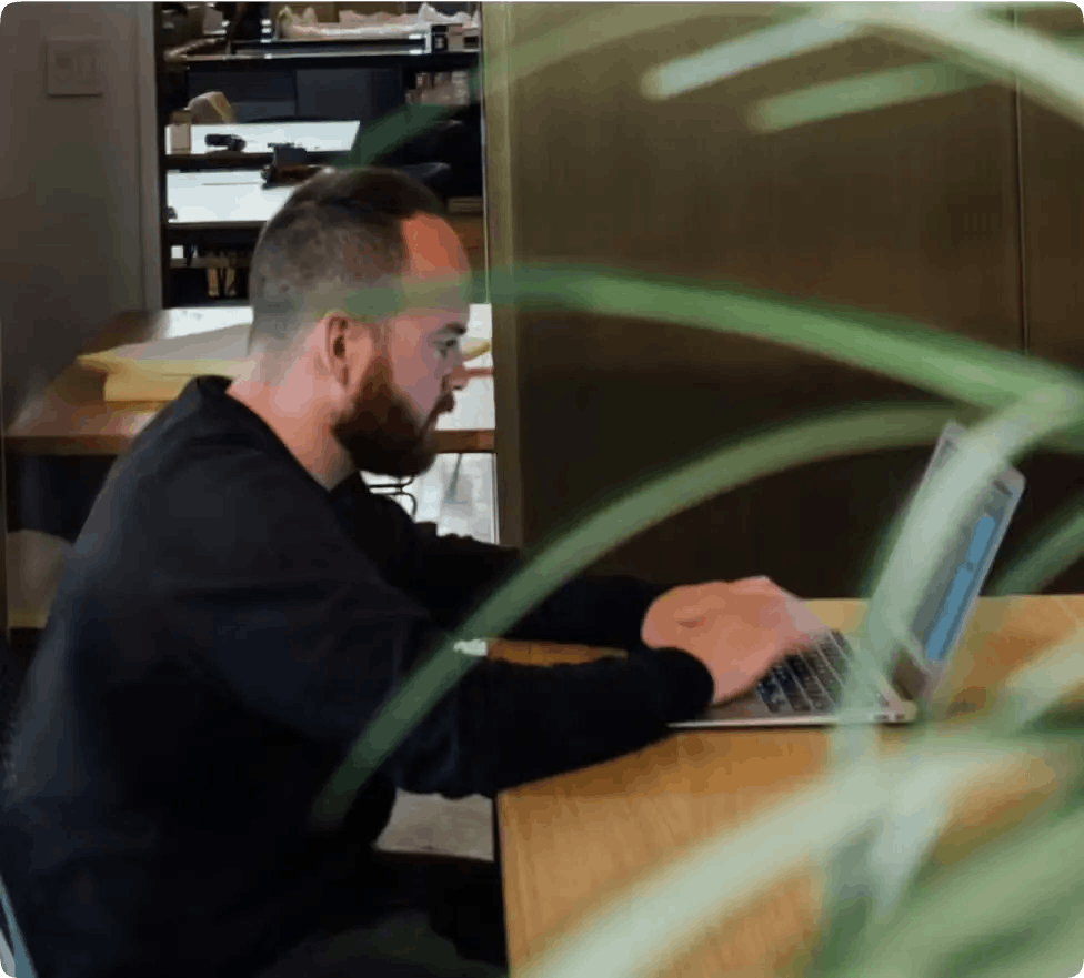 man creating a video online on a laptop