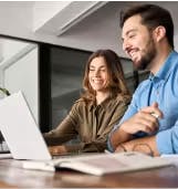 woman and man watching a webinar on a laptop