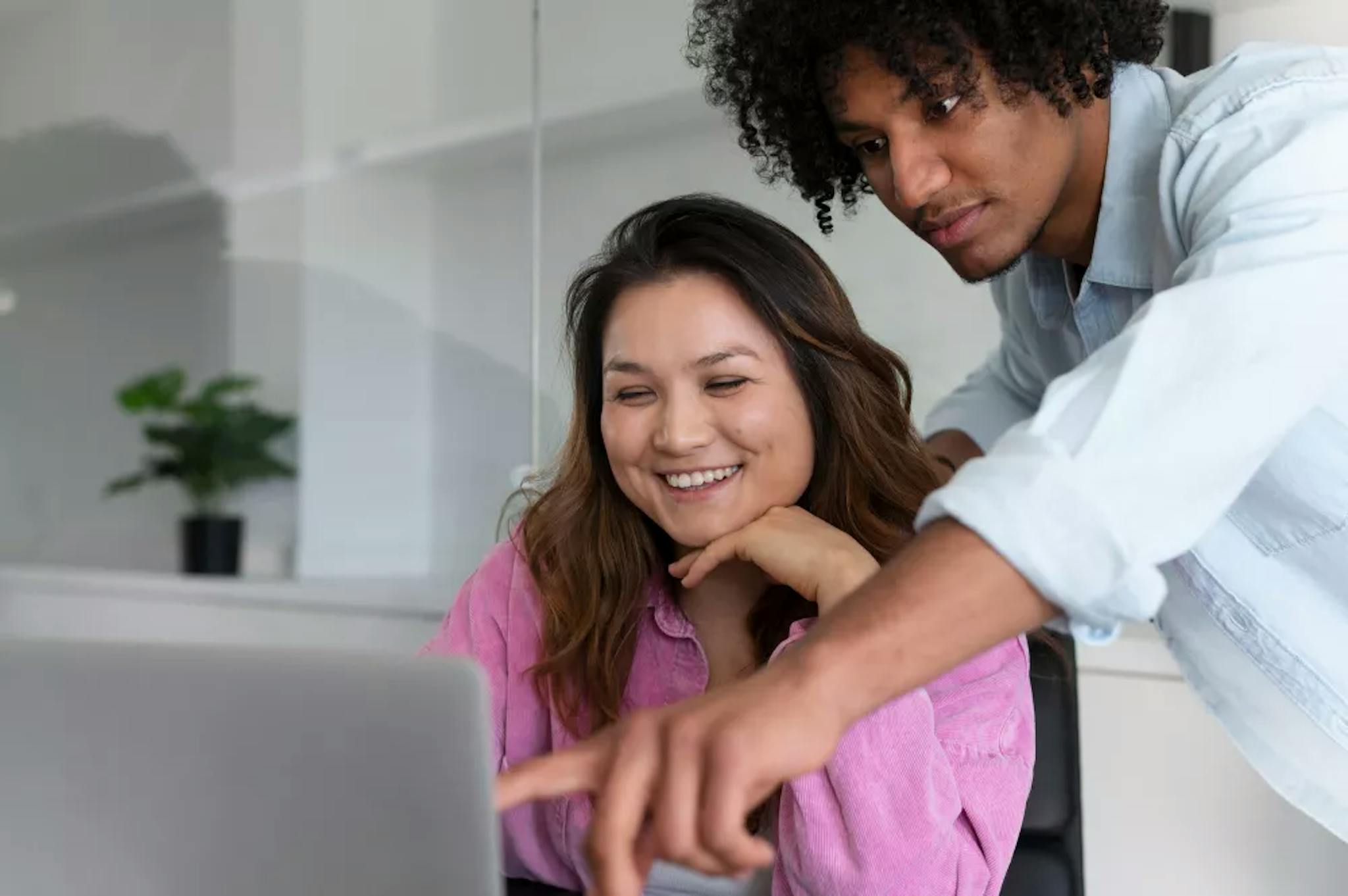 A woman and a man working in consulting