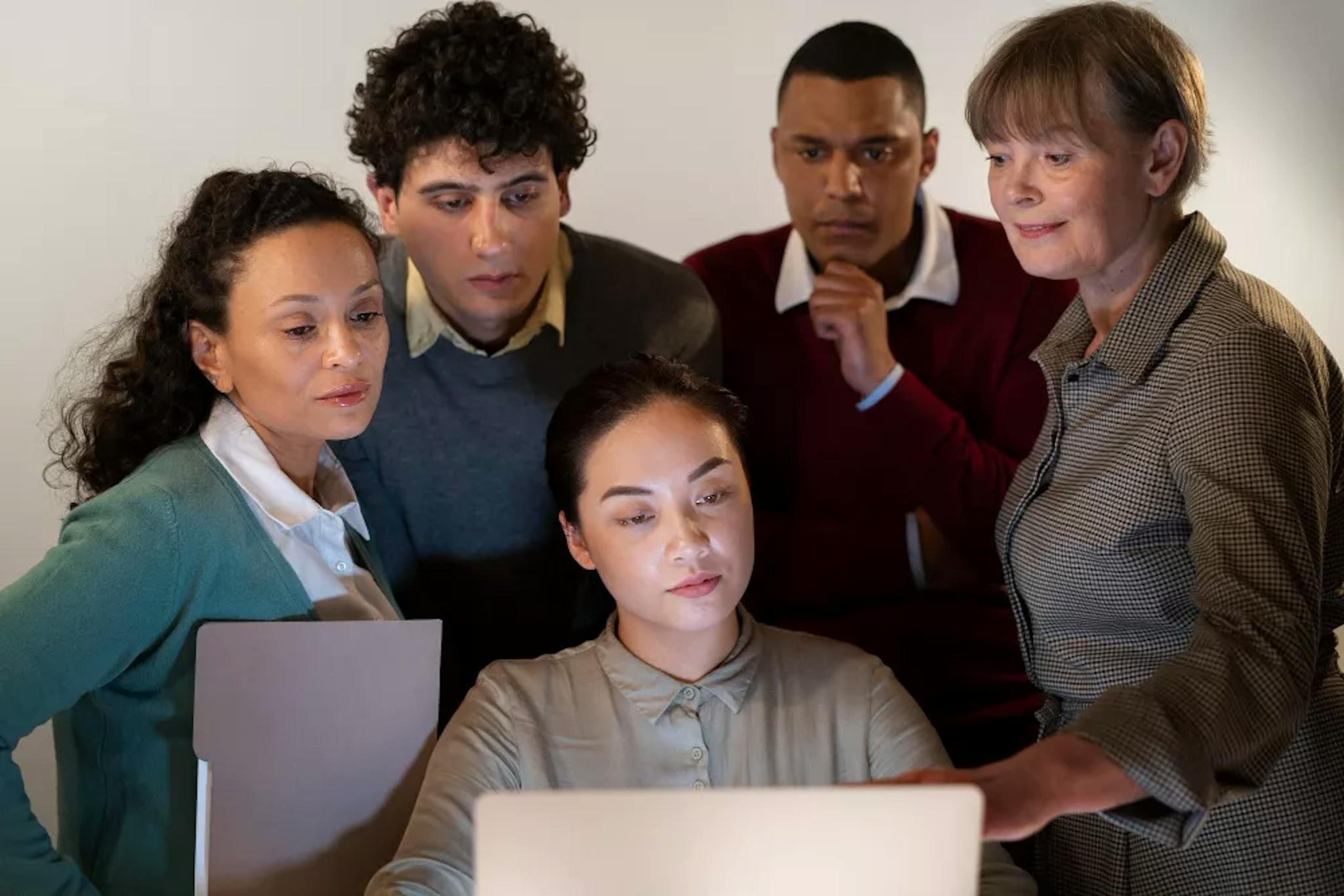 five coworkers watching an internal communication video