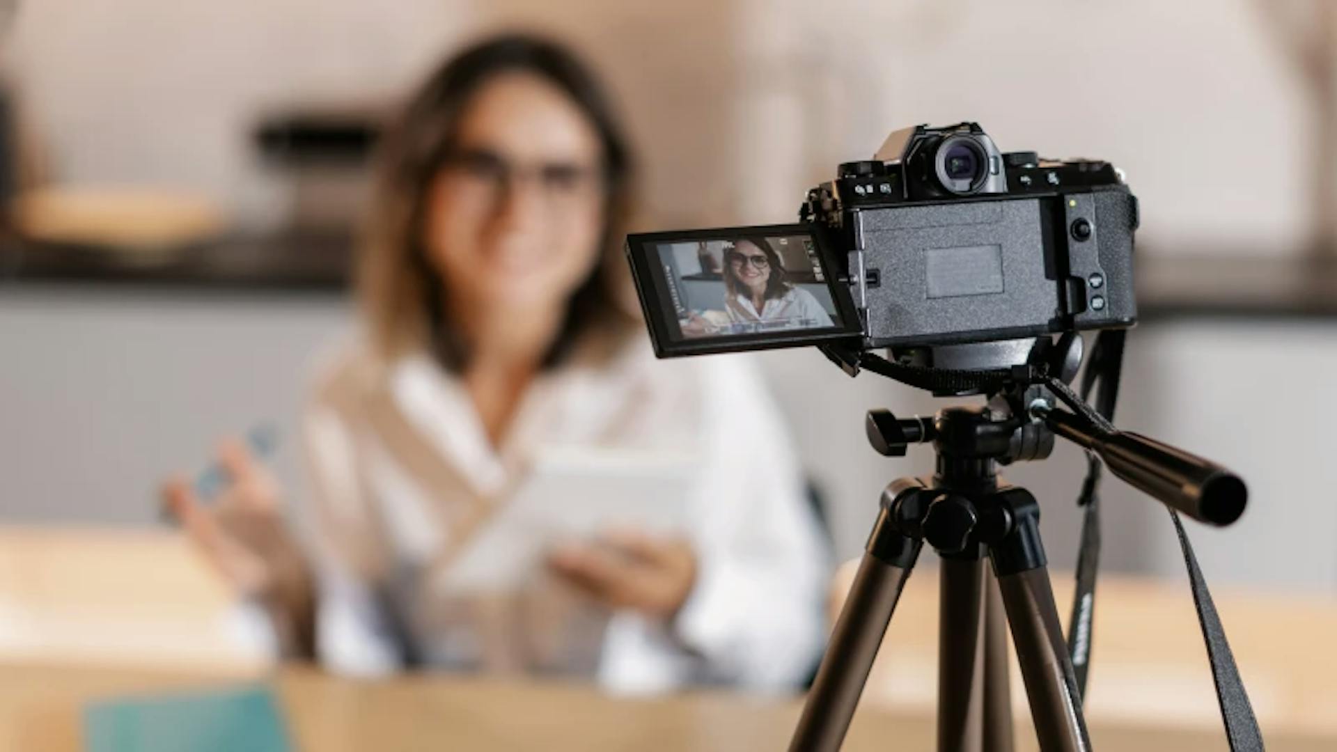 a camera films an advertising video with a woman