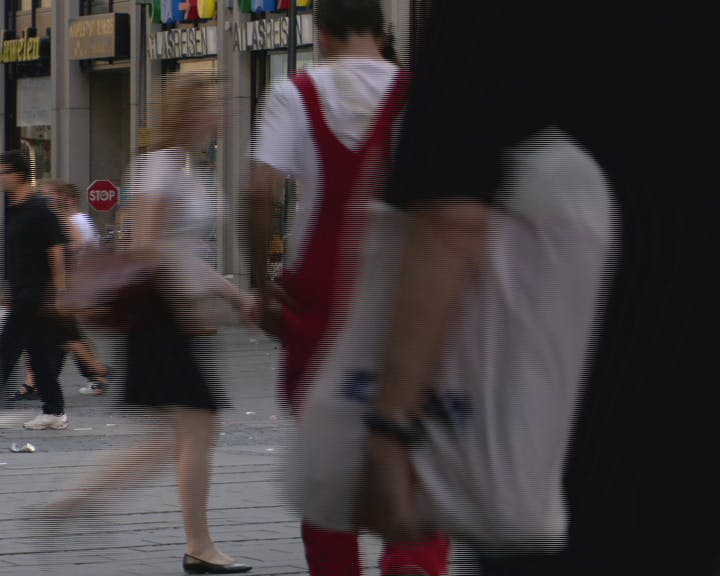 Pedestrians walking in the street. 