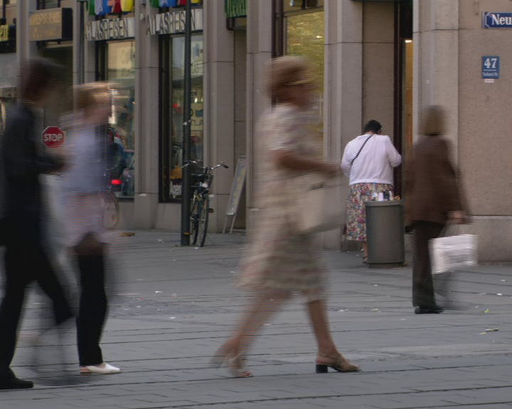 Pedestrians walking in the street. 