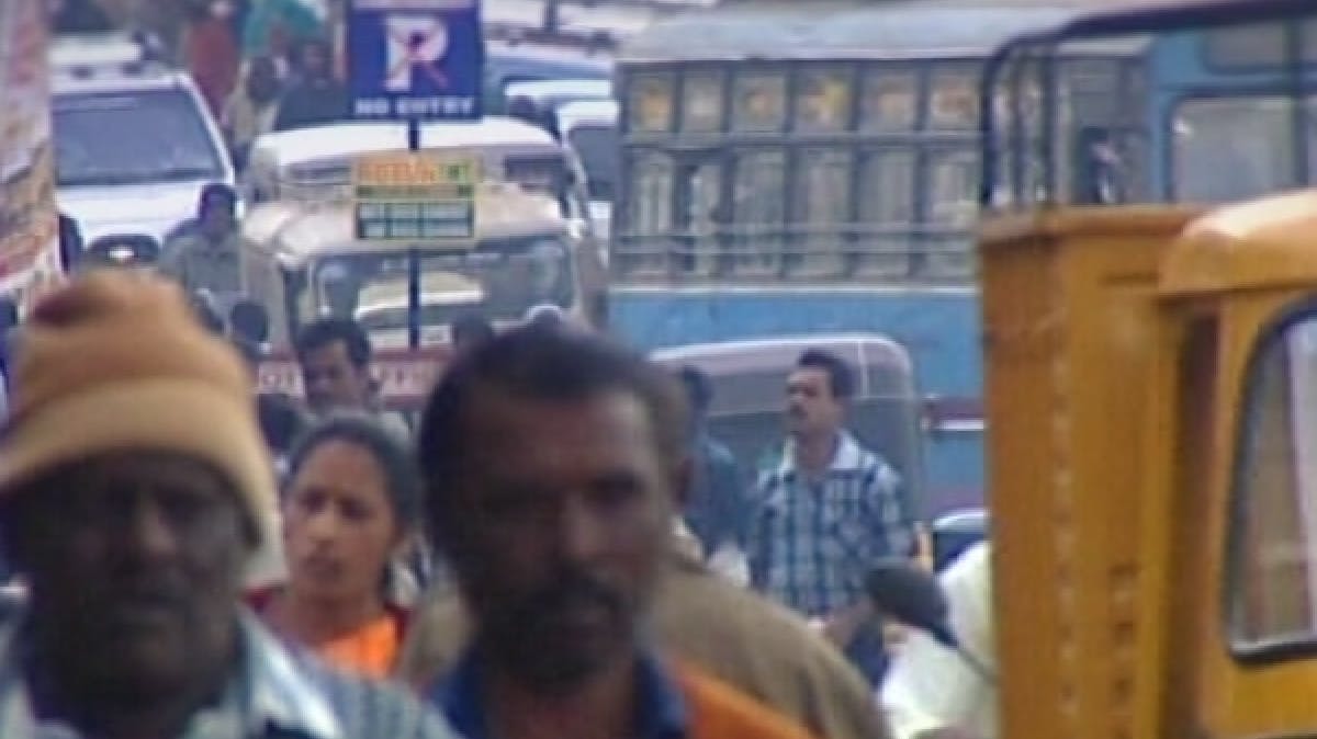 People walking on a busy South Asian street