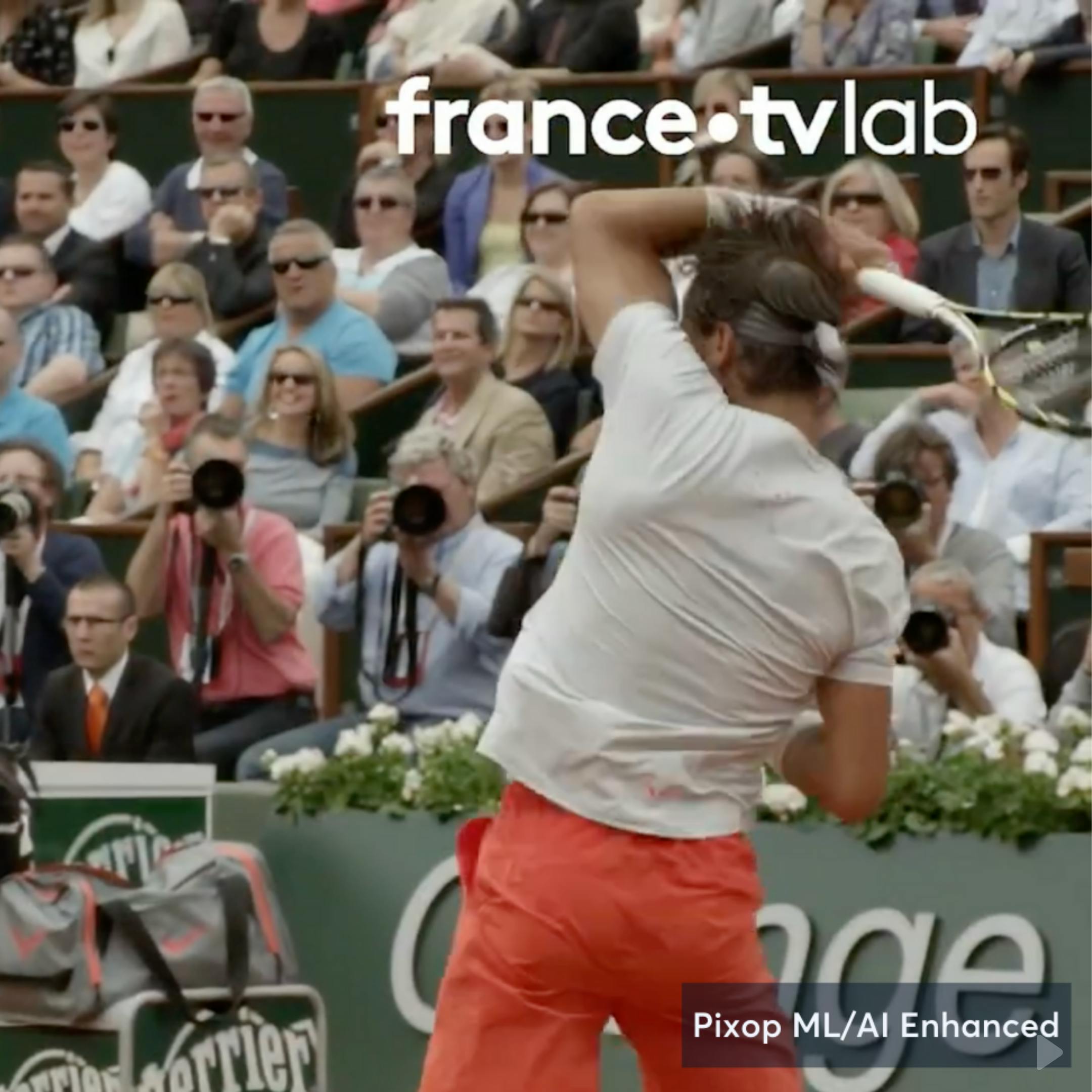 Man in orange shorts playing tennis