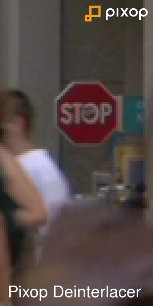 Pedestrians in front of a stop sign 