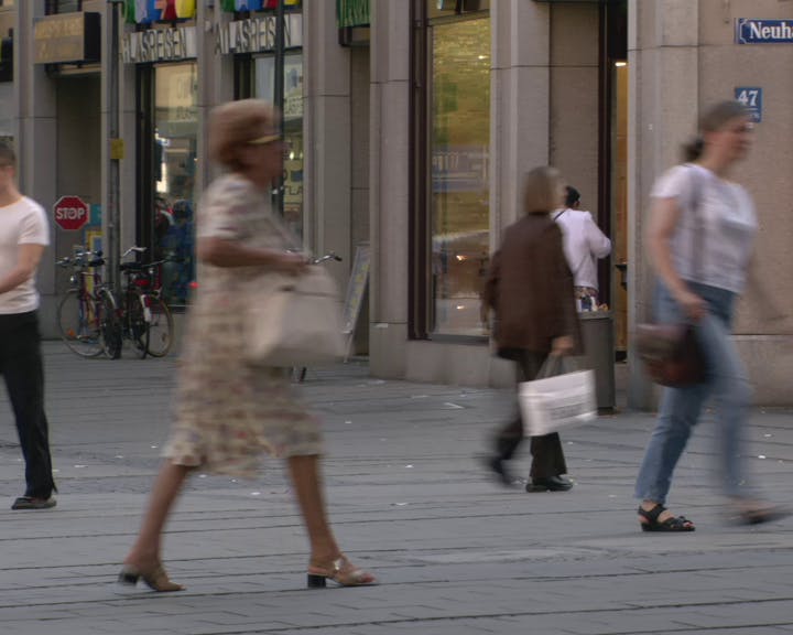 Pedestrians walking in the street. 