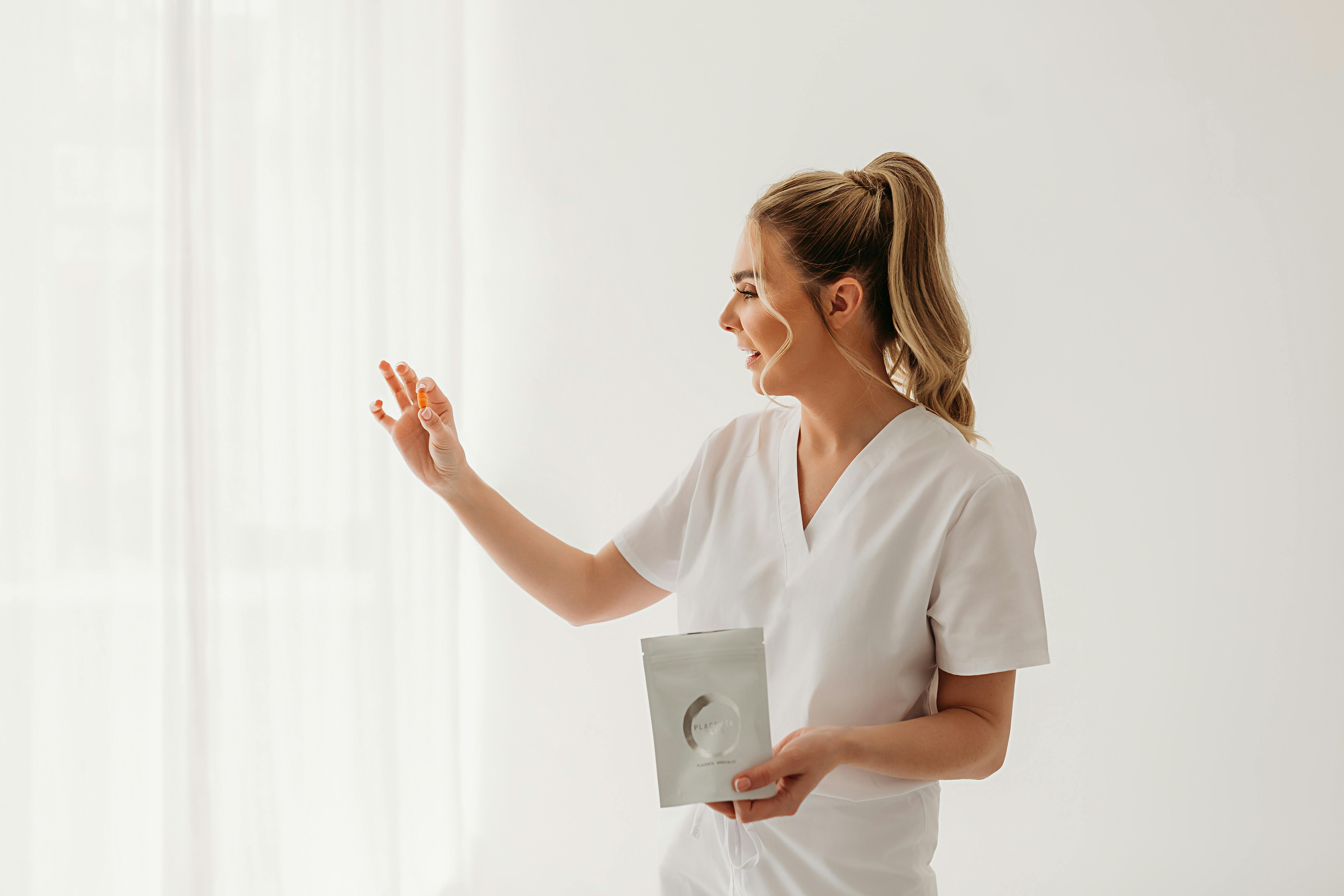 Woman holding Placenta pills