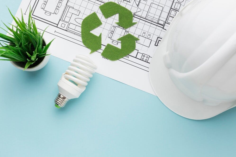 Planta de construção com um símbolo de ecológico em cima