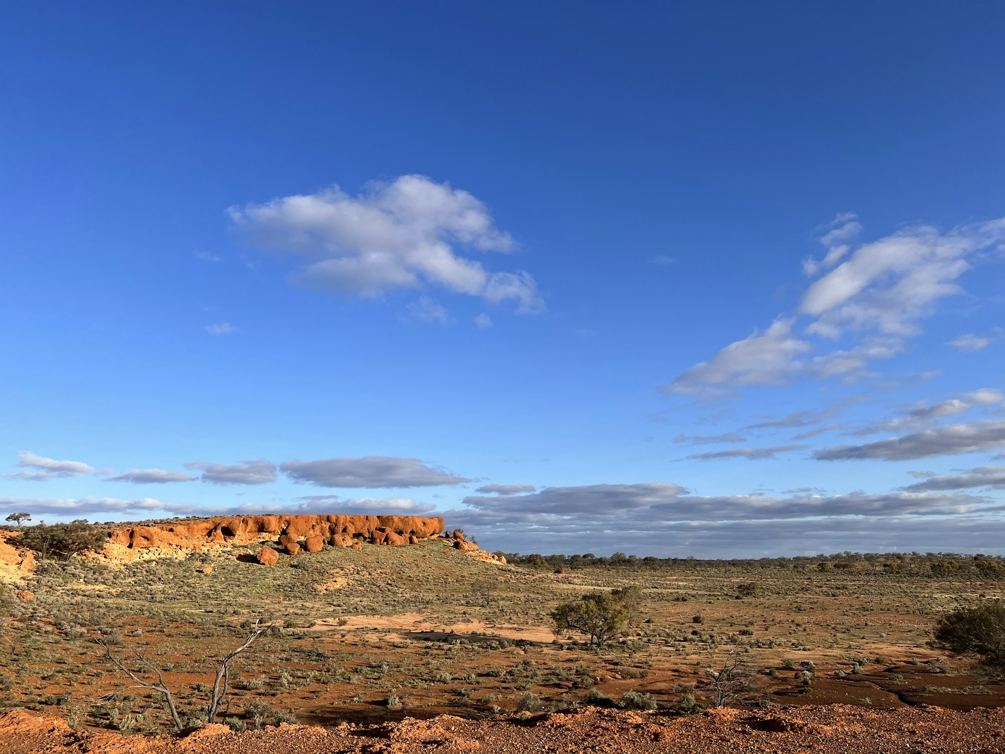 a desert landscape with a blue sky