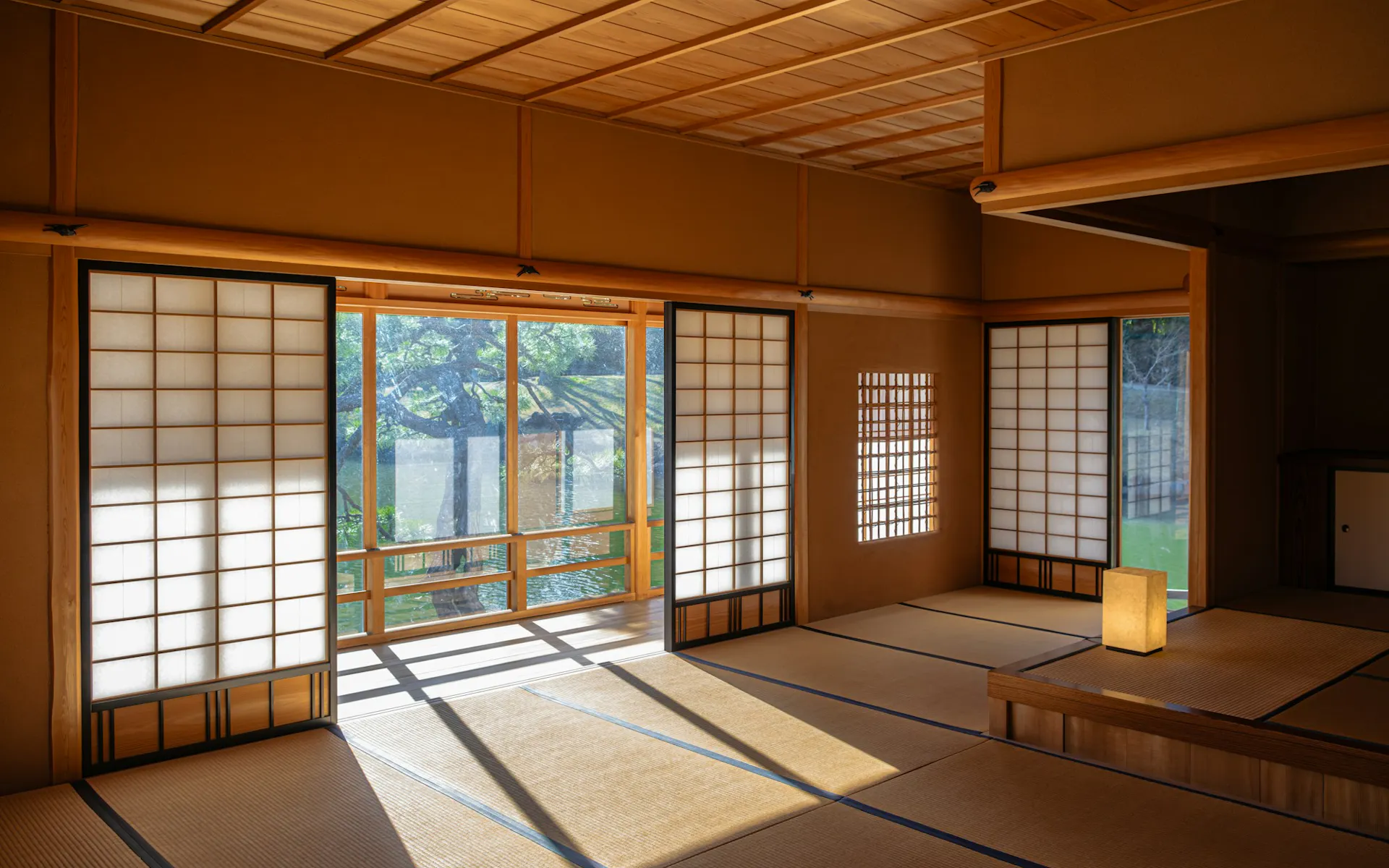 an empty room with sliding doors and windows