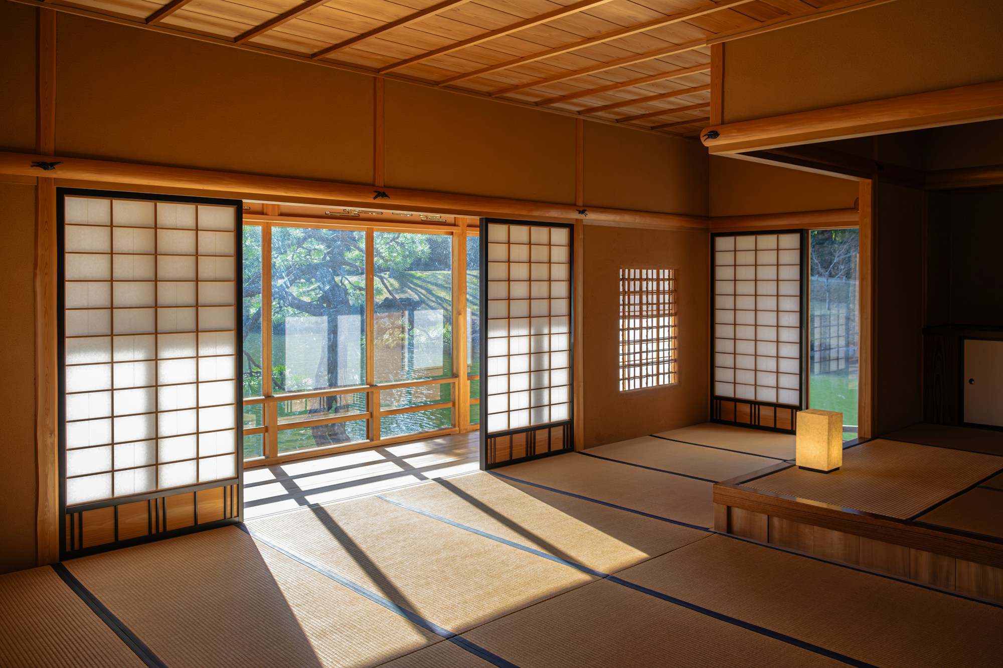 an empty room with sliding doors and windows