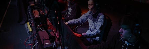 Gamers sitting in front of desks