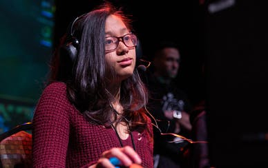 Girl with glasses playing a game