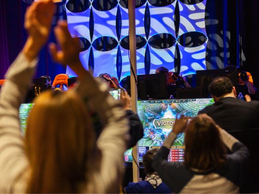 Fans cheering on an esports team