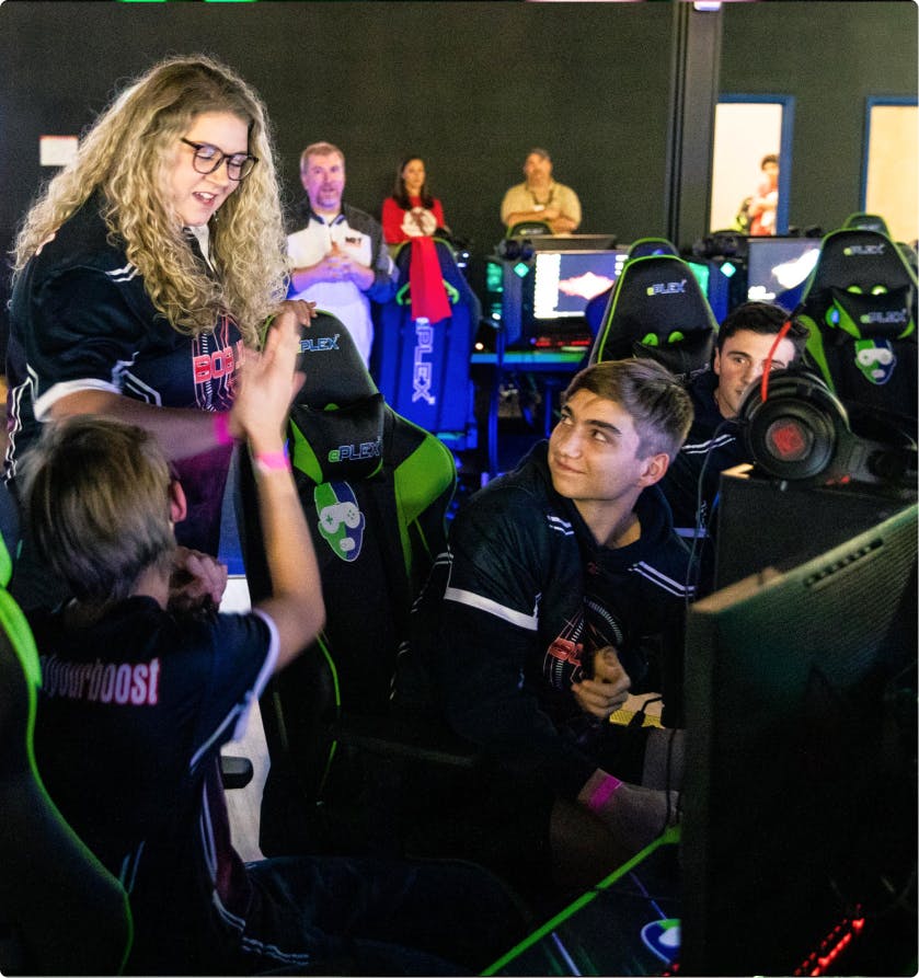 group of high school kids playing esports