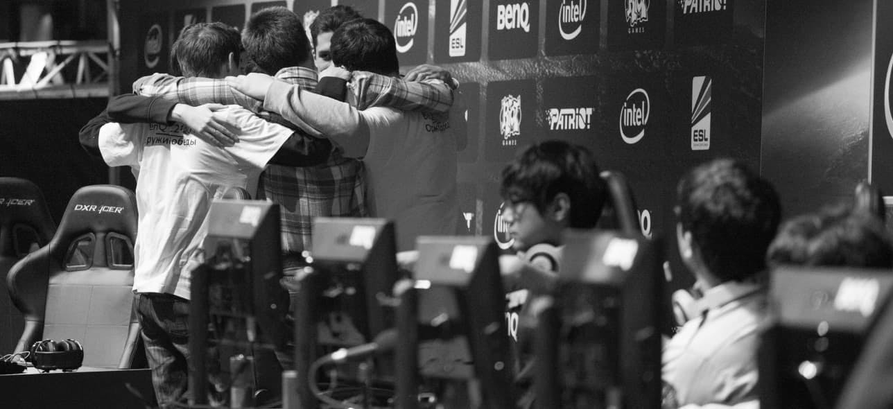 Esports team huddling together before a match begins