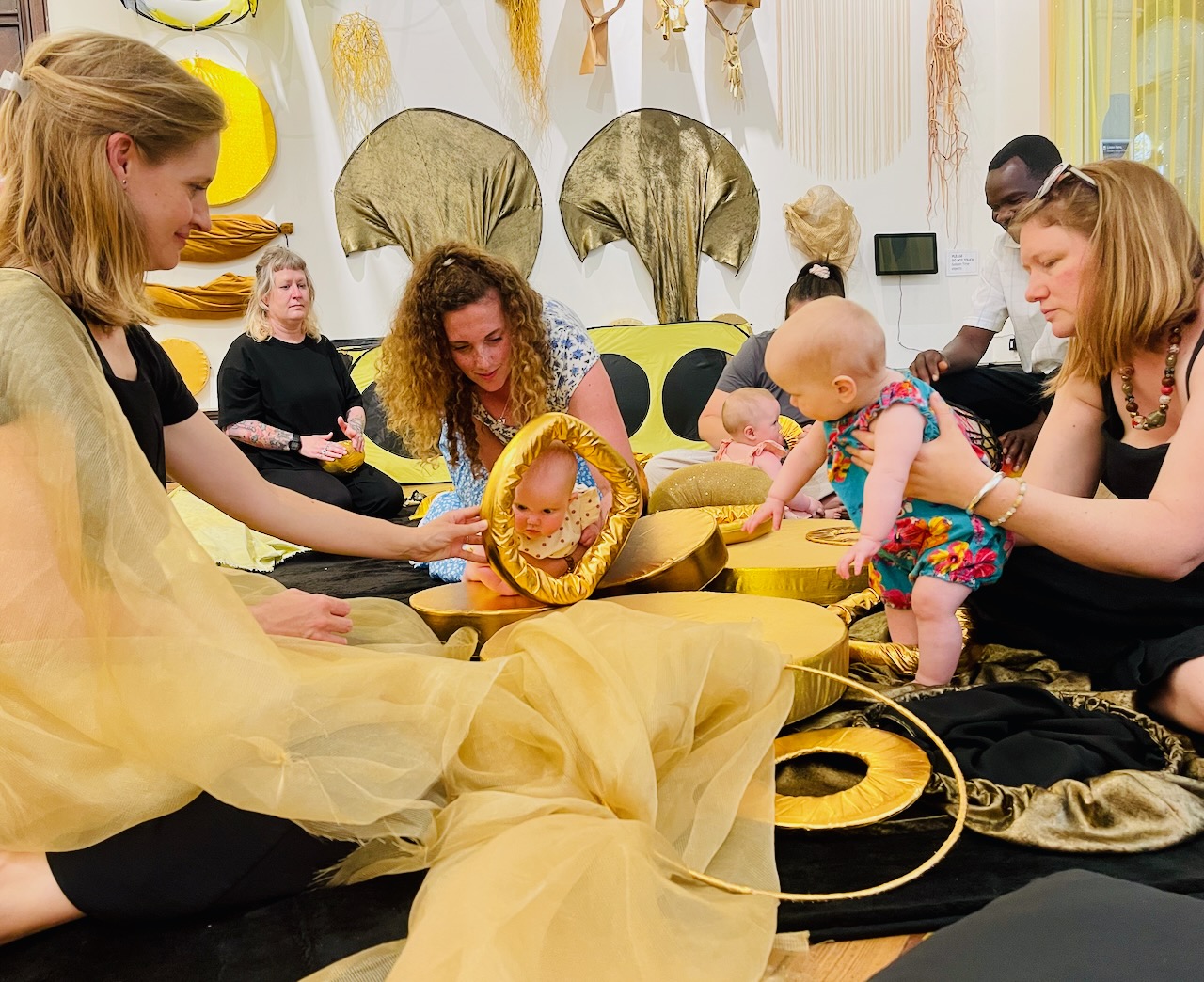 Babies, parents, carers and artists engaging with each other during a session 