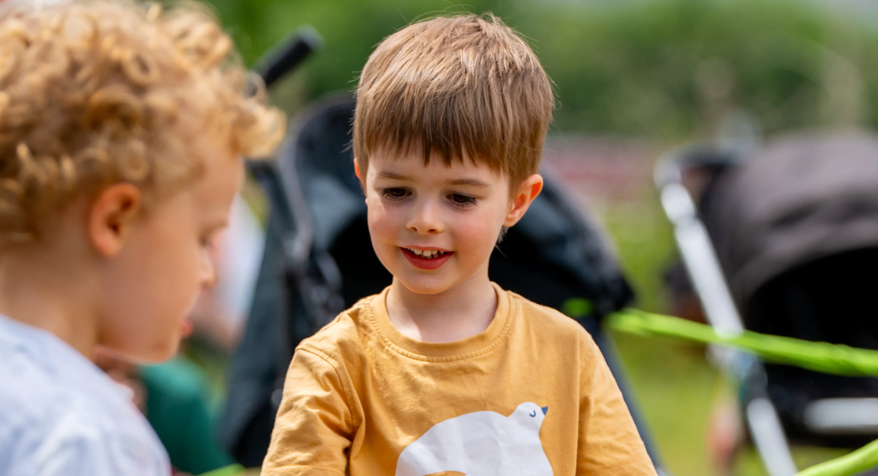 Two children engaging with rope together