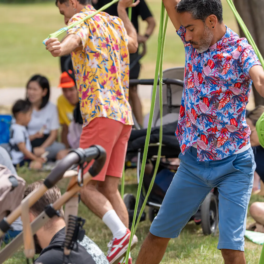 Two artists outdoors during a performance of Tangle