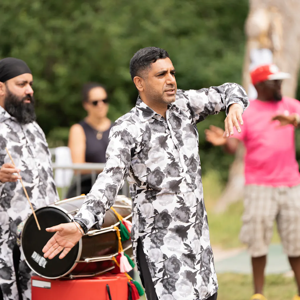 Two performers from Cohesion Plus during a performance of Baby Bhangra